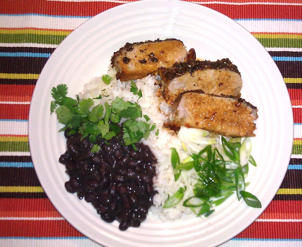 Cuban style pork loin, black beans and white rice with garlic and olive oil