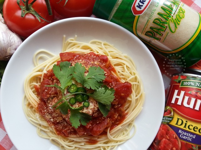 Serve the spaghetti on a plate, add the sauce, sprinkle with parmesan cheese and garnish with cilantro and fresh serranos #FlavorServed #ad