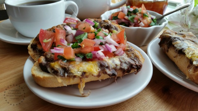 Molletes are like a bruschetta but with refried beans and topped with melted cheese and Mexican salsa over a toasty bread #AmericasTea #ad Molletes are like a bruschetta but with refried beans and topped with melted cheese and Mexican salsa over a toasty bread #AmericasTea #ad