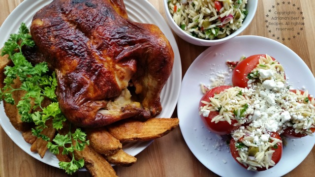 Rotisserie chicken paired with potato wedges and tomatoes stuffed with orzo salad #SummerYum #ad 