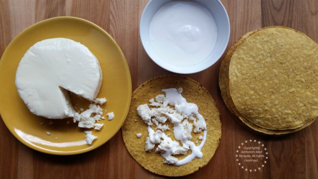 Making tostadas with cream and crumbled queso fresco as a side for the chicken pozole #ABRecipes #TASTE15 Making tostadas with cream and crumbled queso fresco as a side for the chicken pozole #ABRecipes #TASTE15
