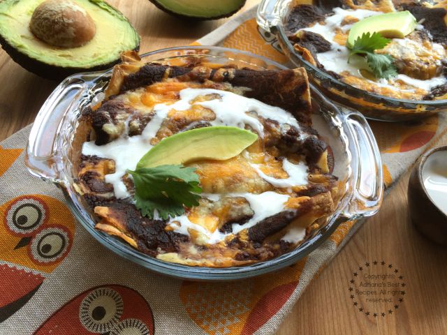 Bean Enchiladas or Enfrijoladas served with cream and avocado