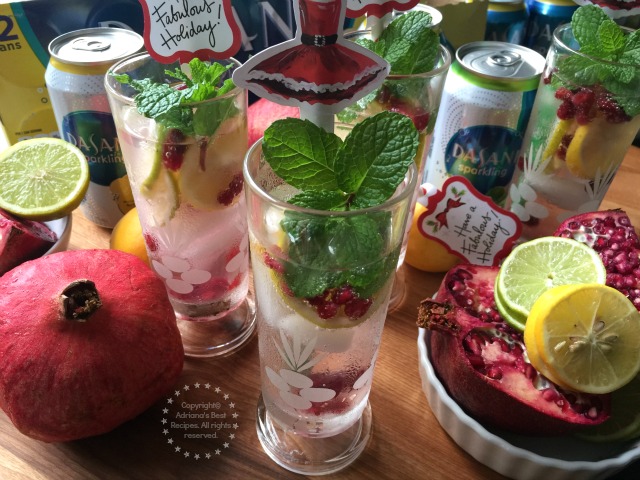 The holidays call for fabulous drinks that are family friendly like this Minty Lemon Lime Pomegranate Spritzer made with fresh seasonal fruit, citrus and DASANI Sparkling Water #SparklingHolidays #ad