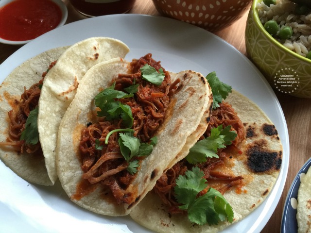 Shredded pork on red chile sauce is perfect for eating with rice and refried beans