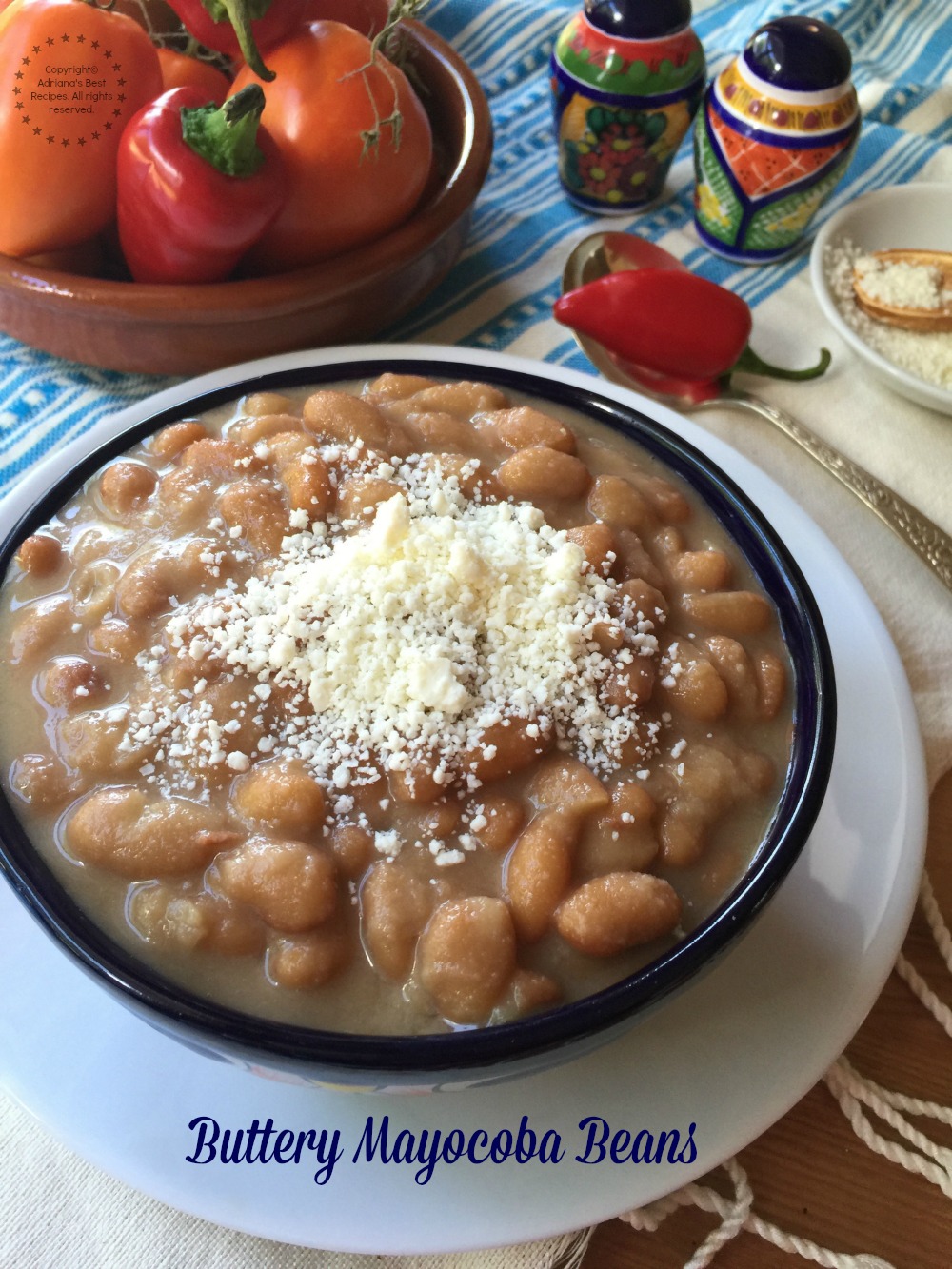 Buttery mayocoba beans garnished with cotija cheese