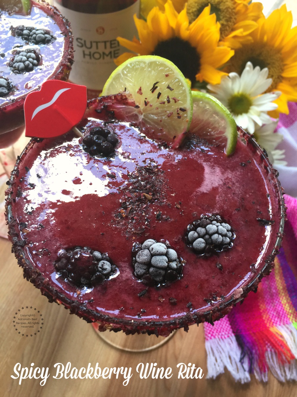 Cheers with this Spicy Blackberry Wine Rita made with frozen store bought margarita mix, blackberries, green habanero sauce, tequila blanco, hibiscus salt and Sutter Home Sweet Red Wine