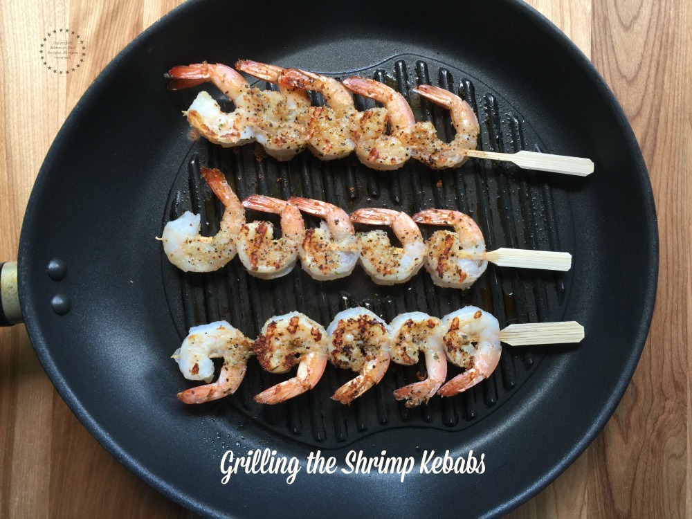 Grilling the shrimp kebabs