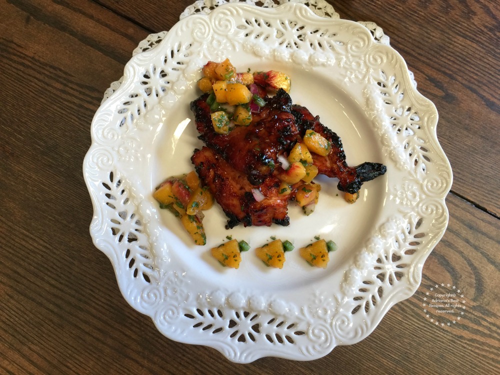 BBQ Chicken garnished with Mango Salsa seasoned with Sriracha Olive Oil