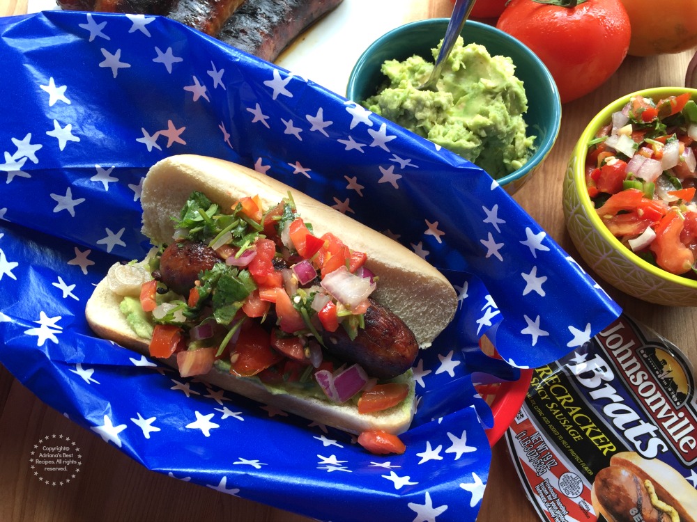 Garnish the Spicy Firecracker Pork Brats with pico de gallo and enjoy