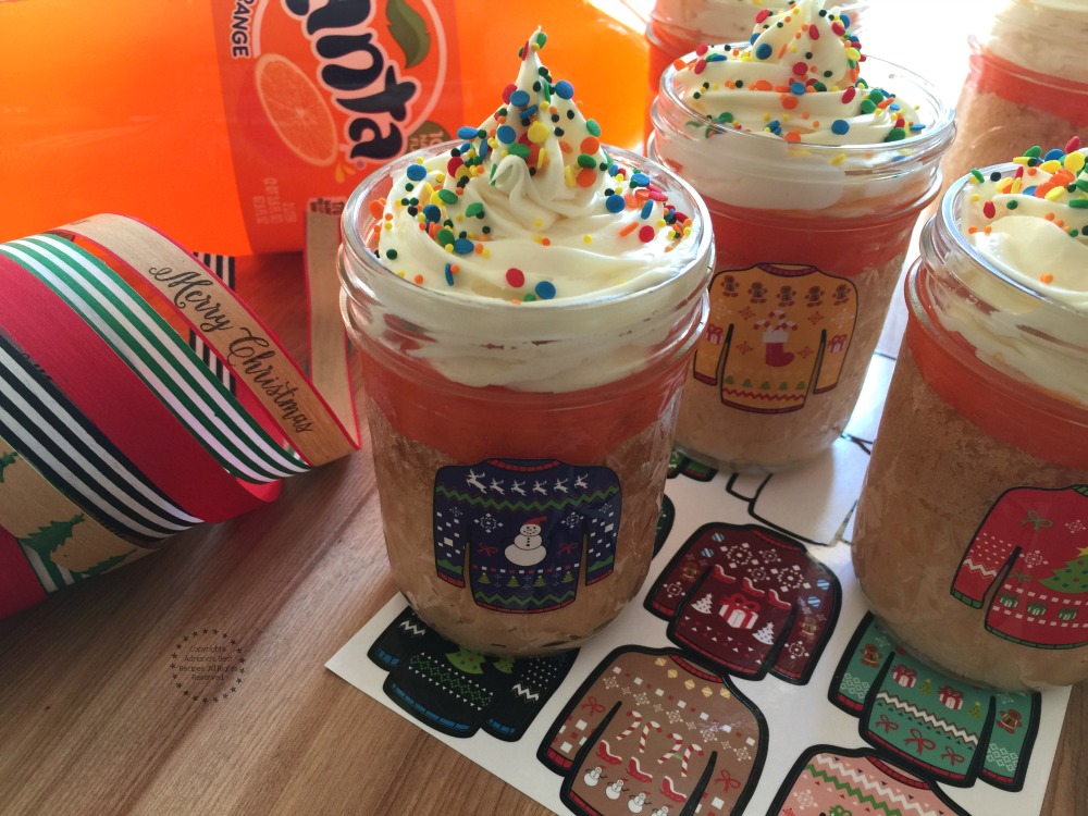 Decorating the Fanta cupcakes with stickers and ribbon