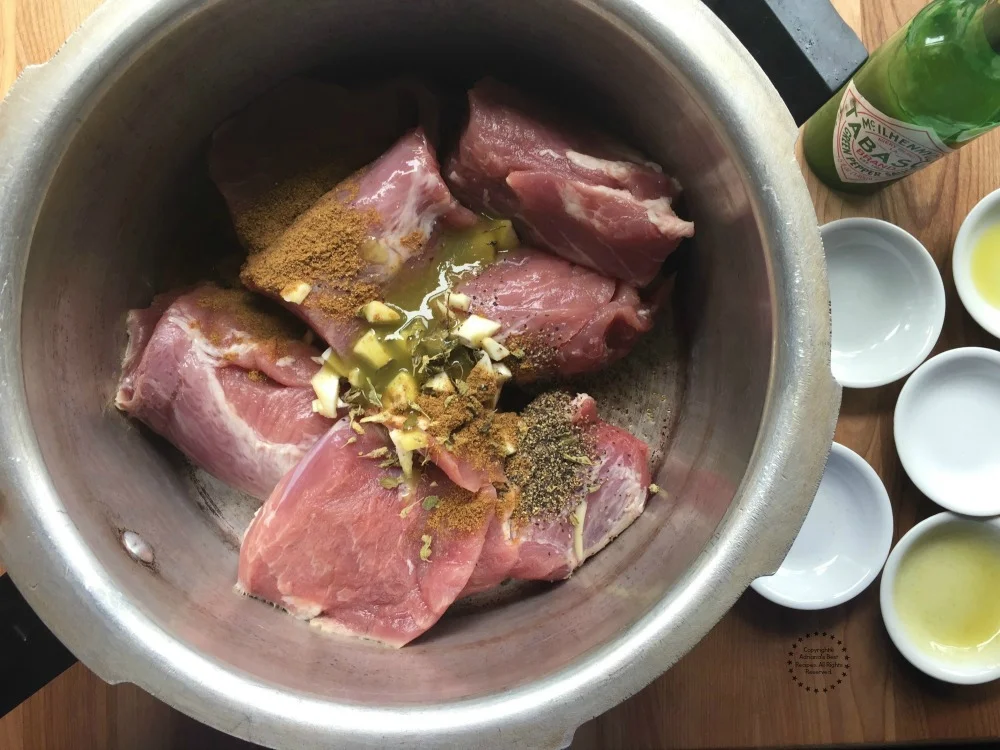 Cooking the lean pork with spices and TABASCO Green Jalapeno Sauce Cooking the lean pork with spices and TABASCO Green Jalapeno Sauce