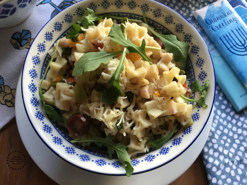 Garnish the pasta with fresh arugula leafs