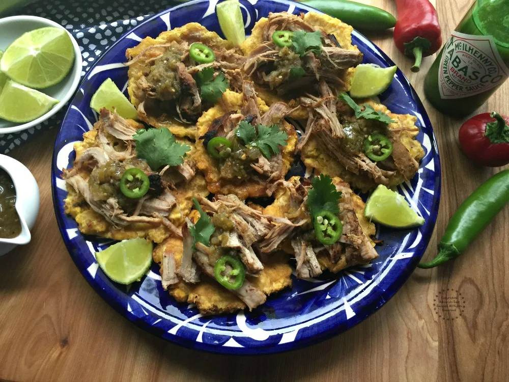 The holidays call for Tostones with Carnitas seasoned with TABASCO Jalapeno green sauce
