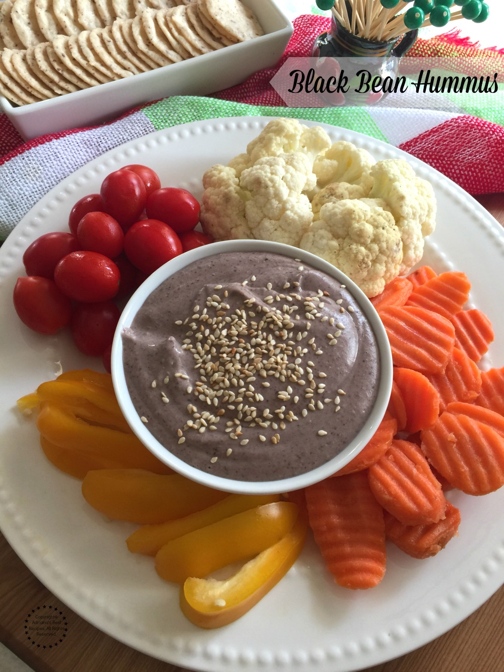 Black bean hummus made with canned beans, tahini, olive oil, lemon juice, garlic and cumin