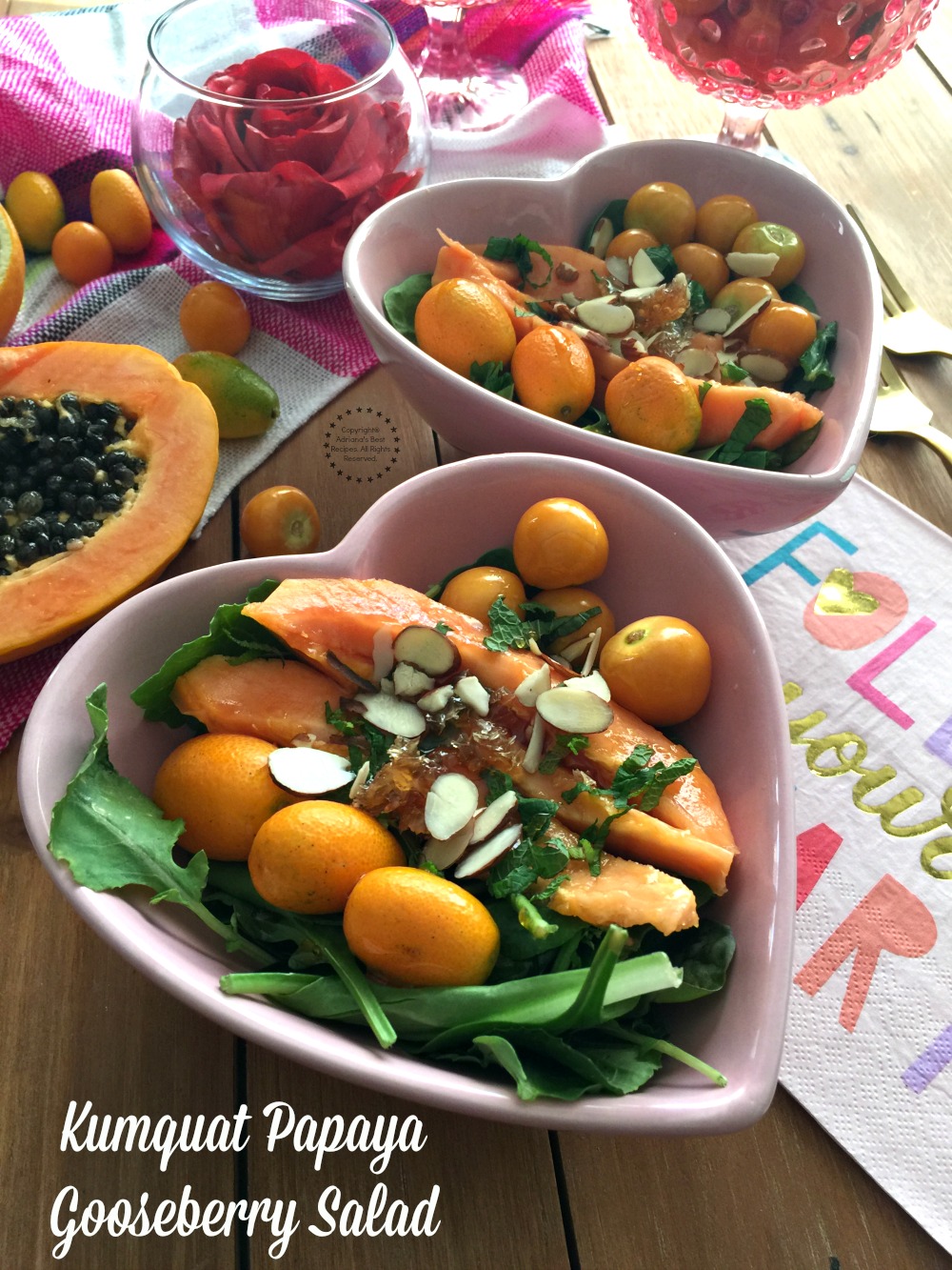 Ensalada de Papaya con Kumquats y Aguaymantos hecha con frutas de temporada y aderezada con una vinagreta cítrica con panal dulce y almendras rebanadas