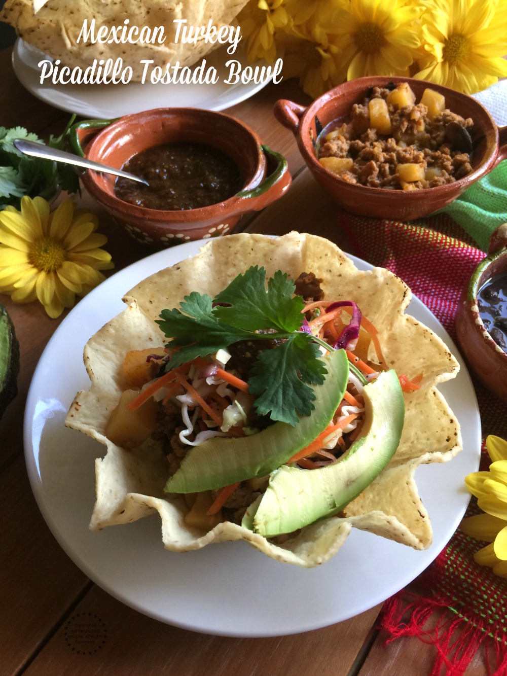 A Turkey Picadillo Tostada Bowl, made with lean ground turkey meat, Mexican spices, mushrooms, chopped jalapeños and diced potatoes