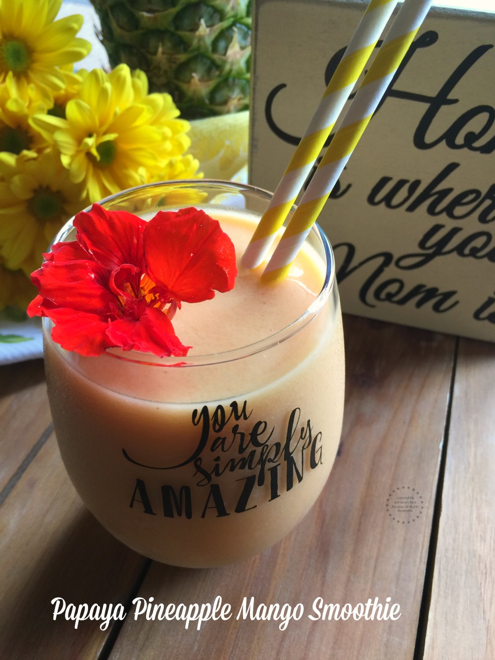 A yummy papaya pineapple mango smoothie with powdered peanut butter and clementine juice