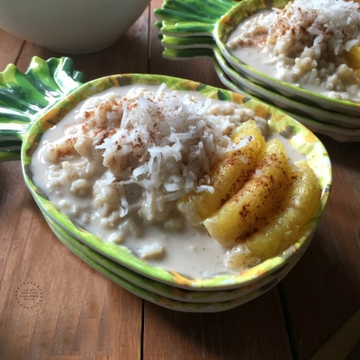 two pineapple bowls with rice pudding