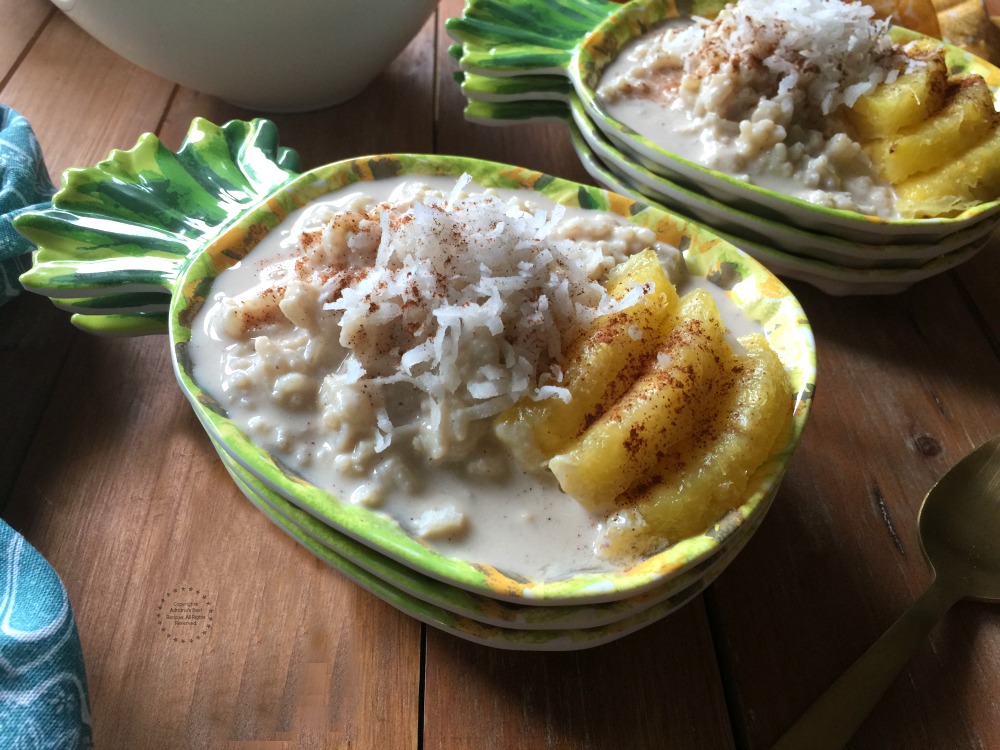 two pineapple bowls with rice pudding