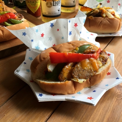 Patriotic Chicken Fajita Hot Dogs with chicken sausage, cheese, and peppers. Served on a decorative star shaped plate and napkins with printed stars.