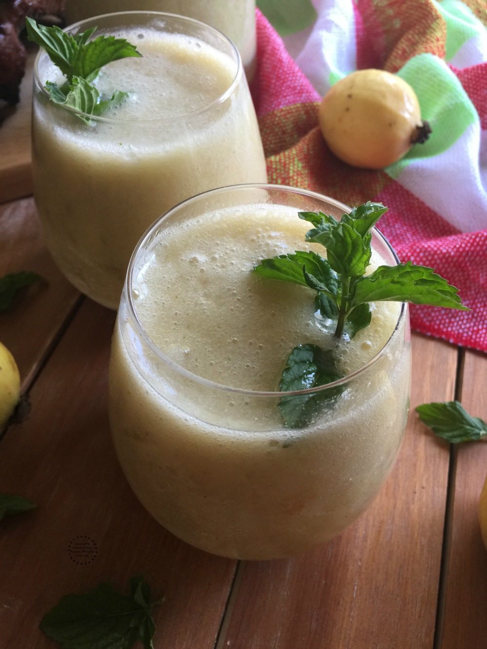 Garnishing the guava agua fresca with fresh mint