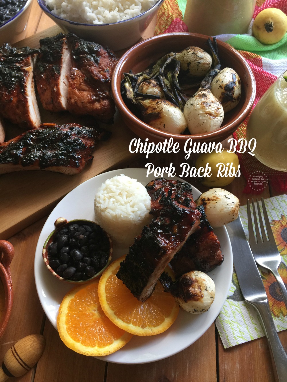A tablescape showcasing a complete meal with chipotle guava pork back ribs