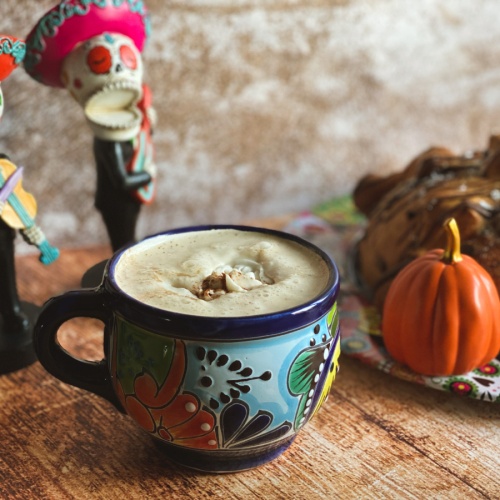 a cup with frothy pumpkin spice cafe de olla