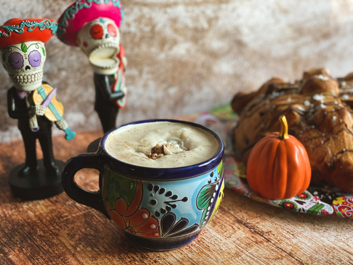 a cup with frothy pumpkin spice cafe de olla