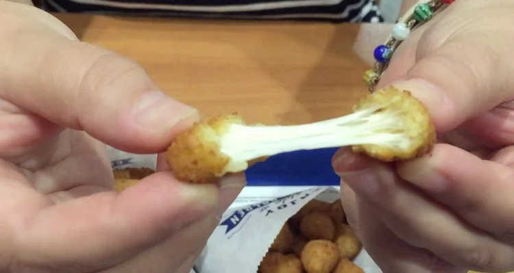 Do a cheese pull to celebrate National Cheese Curd Day Do a cheese pull to celebrate National Cheese Curd Day