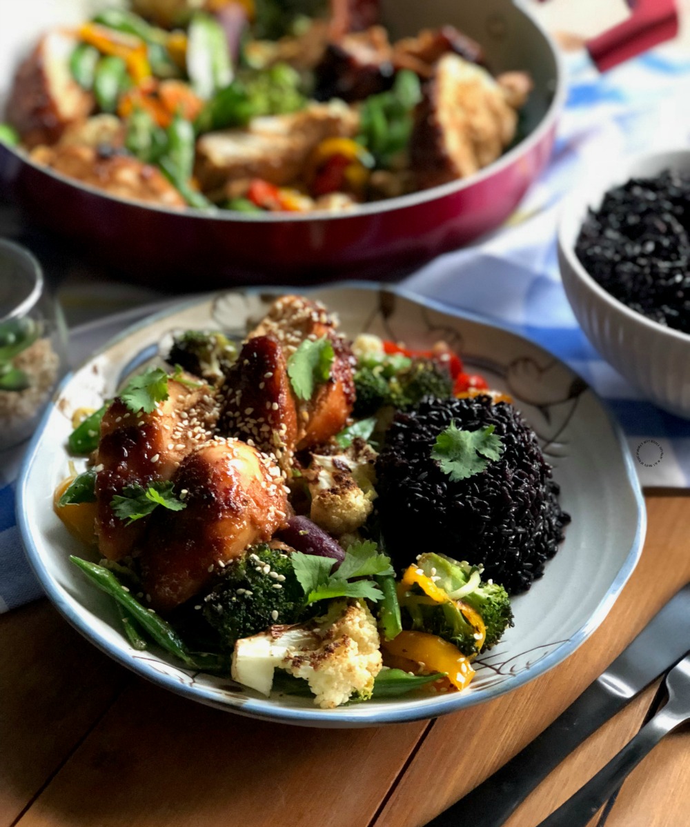 Sheet Pan Hoisin Garlic Chicken is served with a side of Black Rice