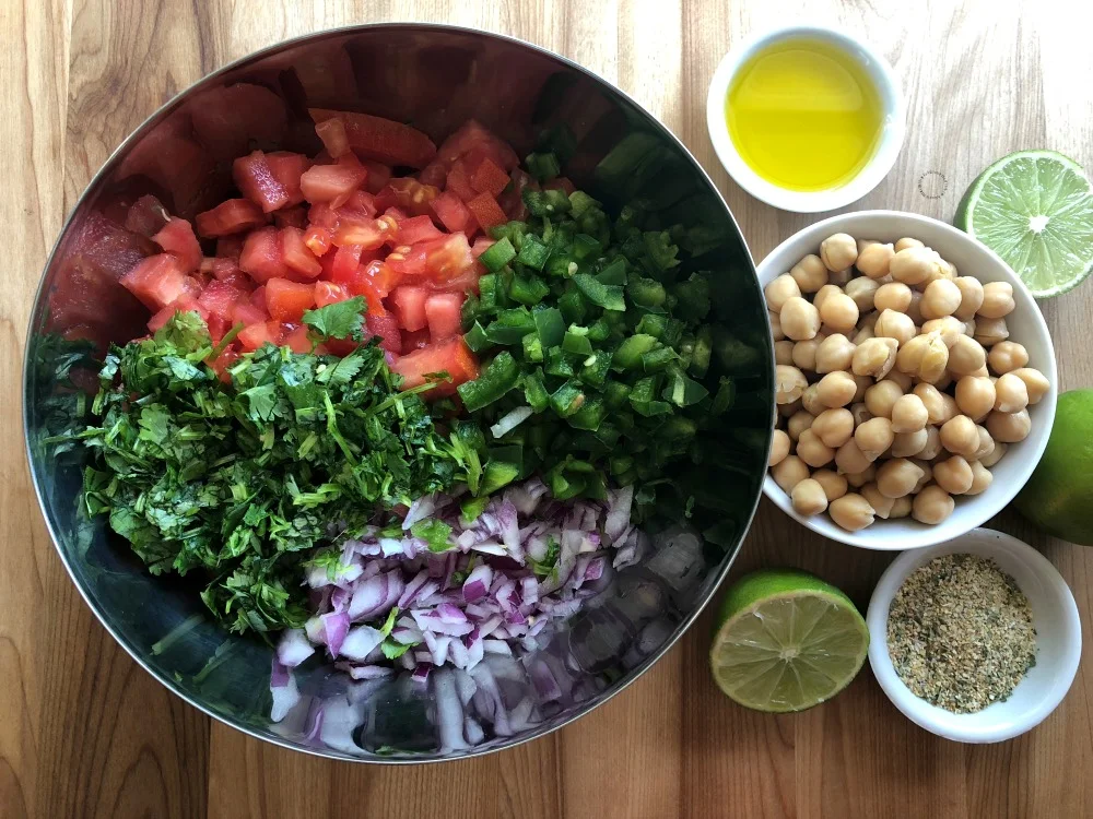 Chop all the produce for making the fresh chickpeas salsa Chop all the produce for making the fresh chickpeas salsa