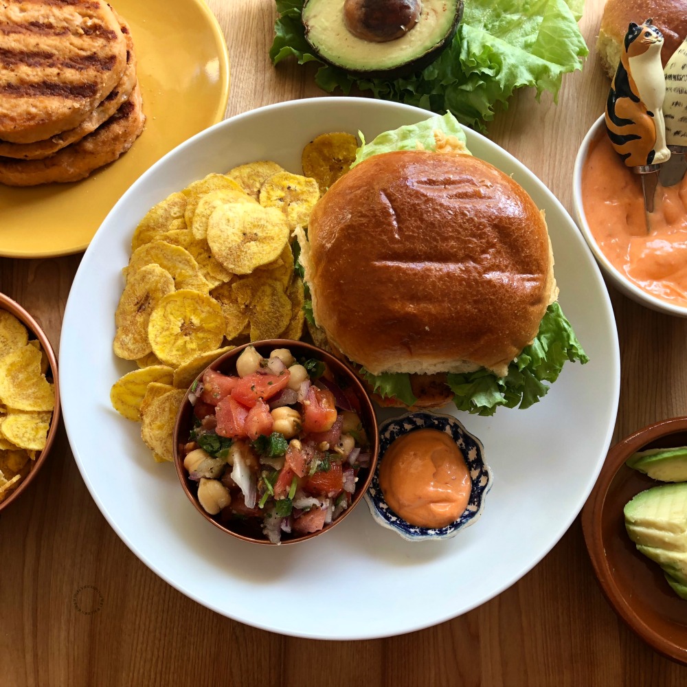 Making grilled salmon burgers paired with a fresh chickpeas salsa