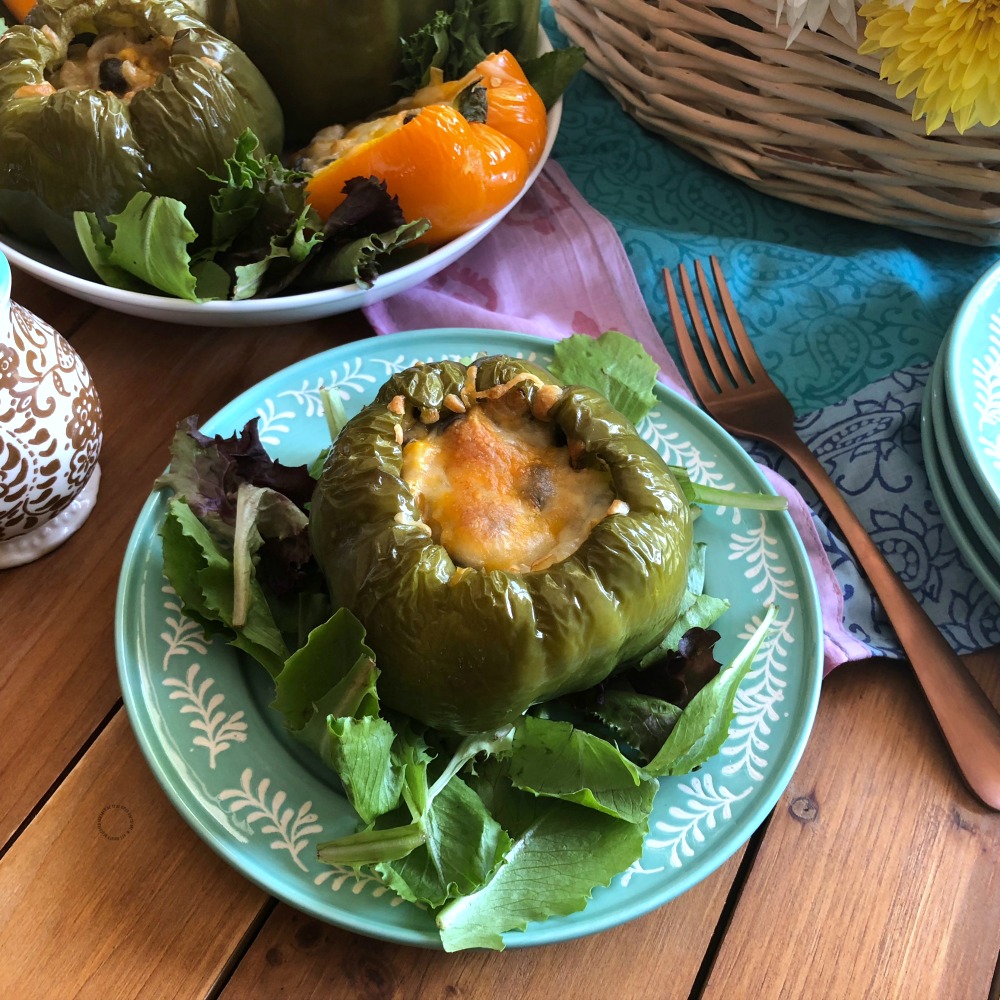 Serving the Mexican Style Stuffed Florida Bell Peppers on a bed of greens for a full meal
