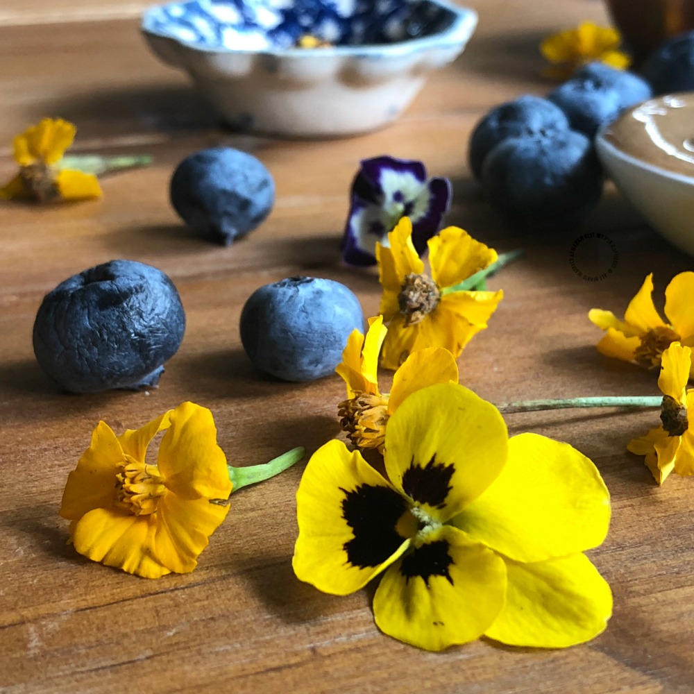 Garnishing with lemon marigold flowers and violas