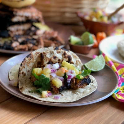 Indulging on exquisite pork tacos al pastor