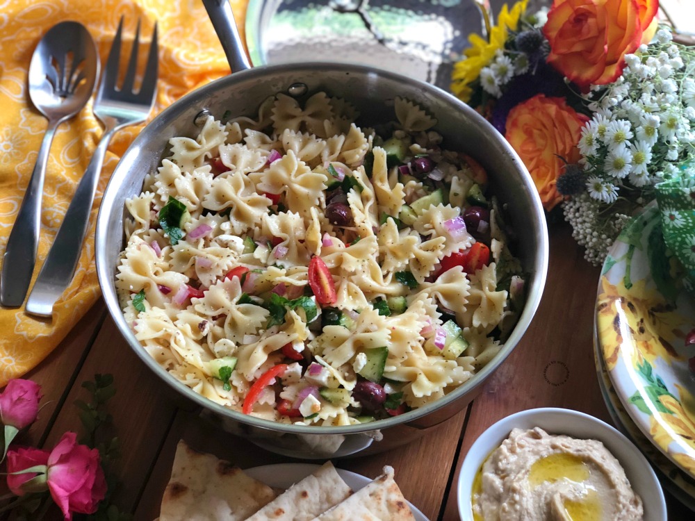 Serving the farfalle pasta salad family style
