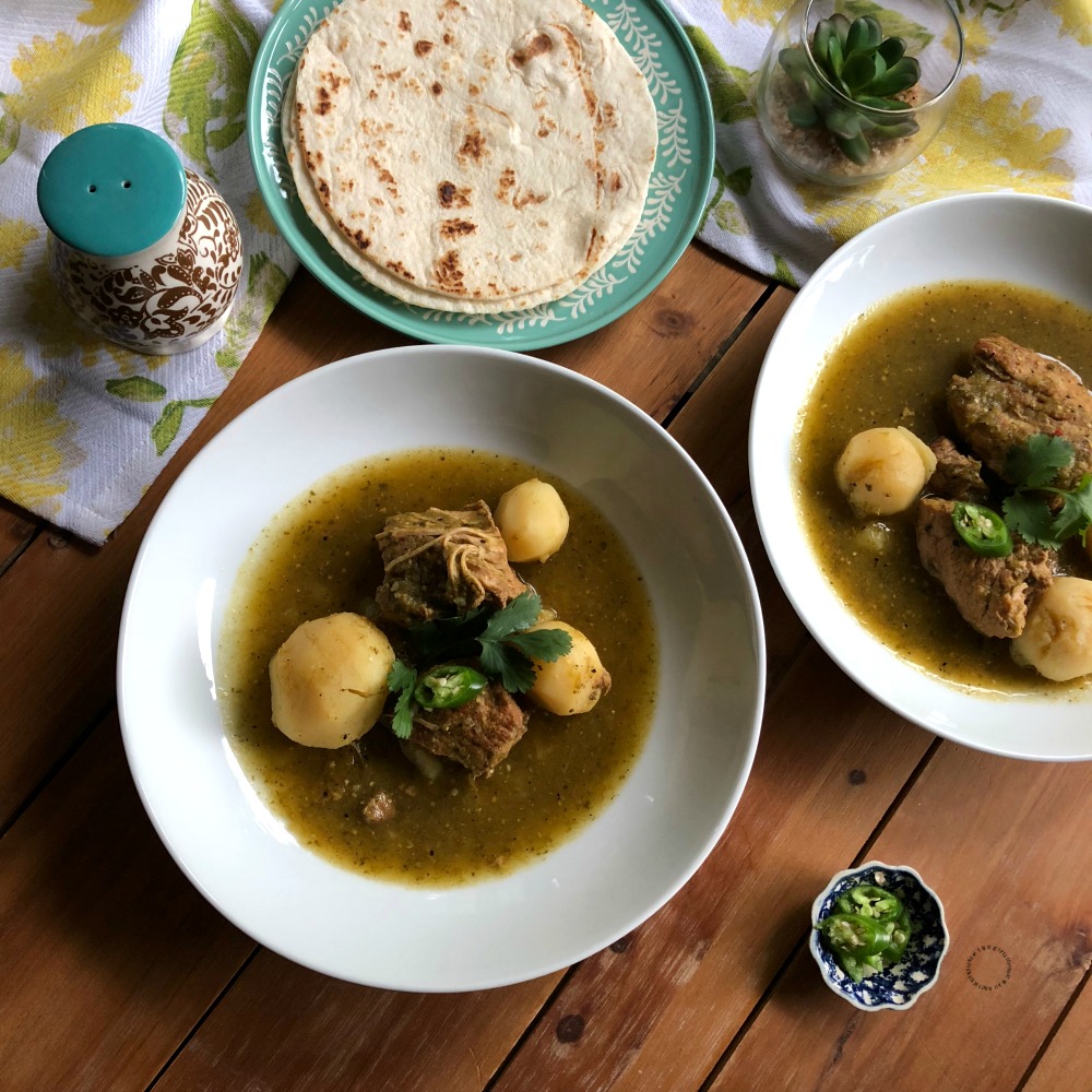 Serve the Instant Pot Salsa Verde Pork Stew with a side of warm flour tortillas