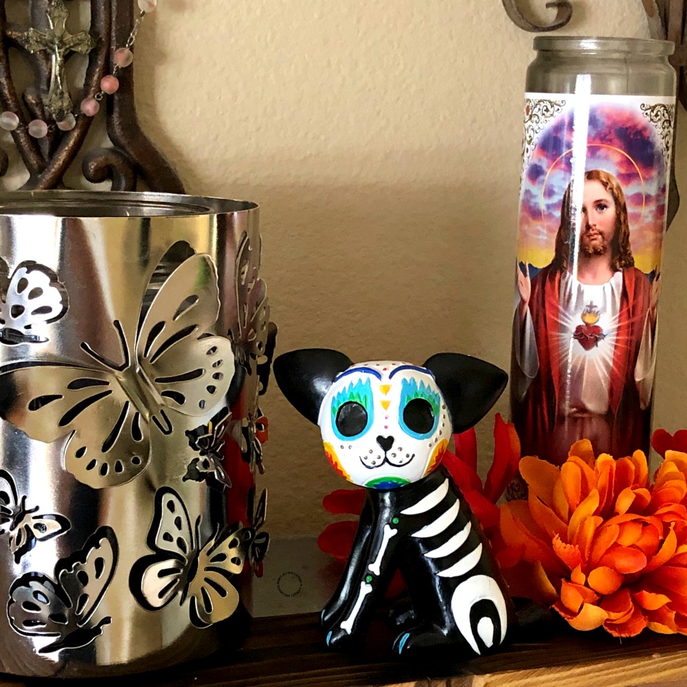 Important symbols of the altar offering such as the Monarch butterfly, the dog and the Sacred Heart