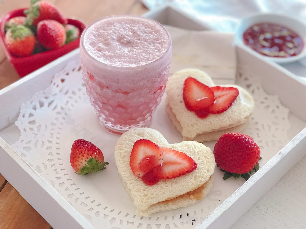 Serving the strawberry jam sandwich hearts with a milkshake