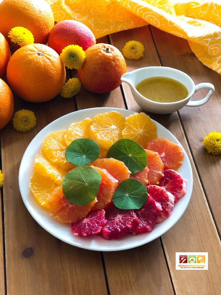 Triple Orange Salad made with raspberry, cara cara and navel oranges