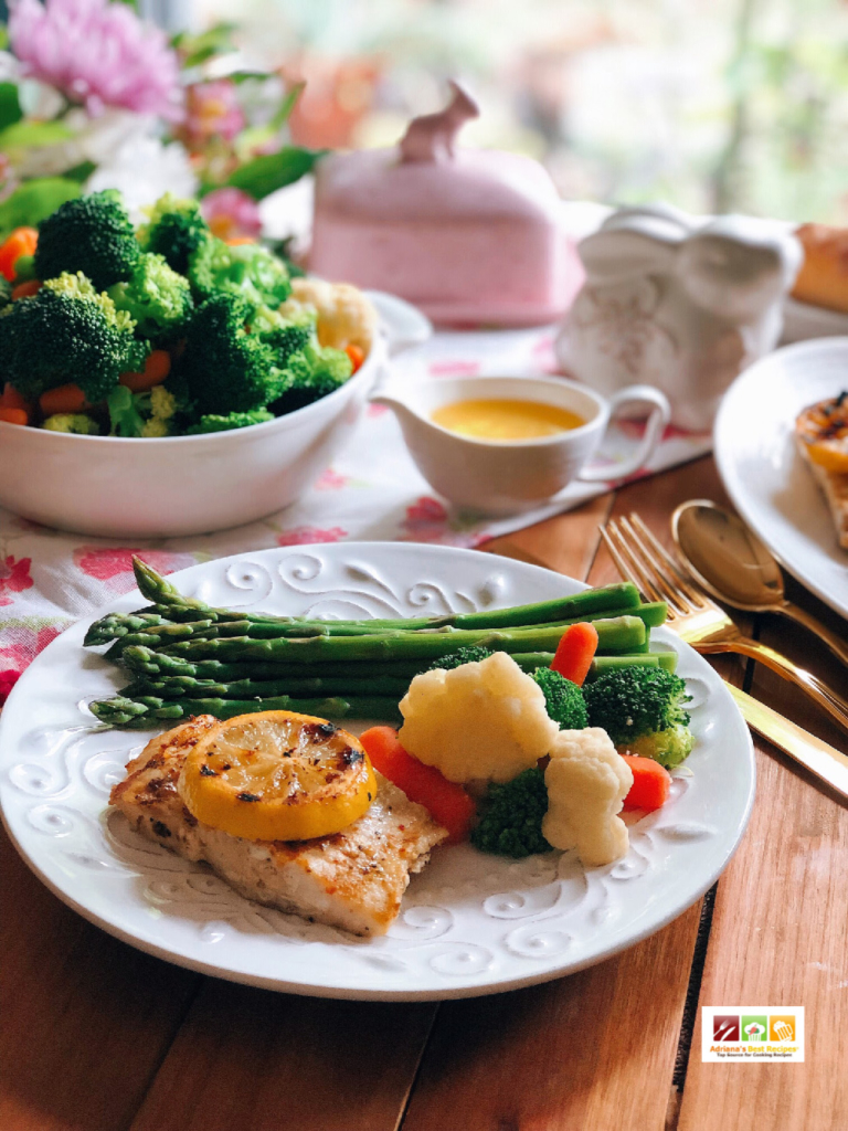 This grilled fish makes an elegant springtime option served on a white plate and with golden silverware 