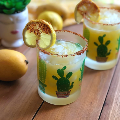 Cheers to a tasty and spicy manila mango mocktail or agua fresca with fresh mango, lemon, sugar, fresh water, and chamoy