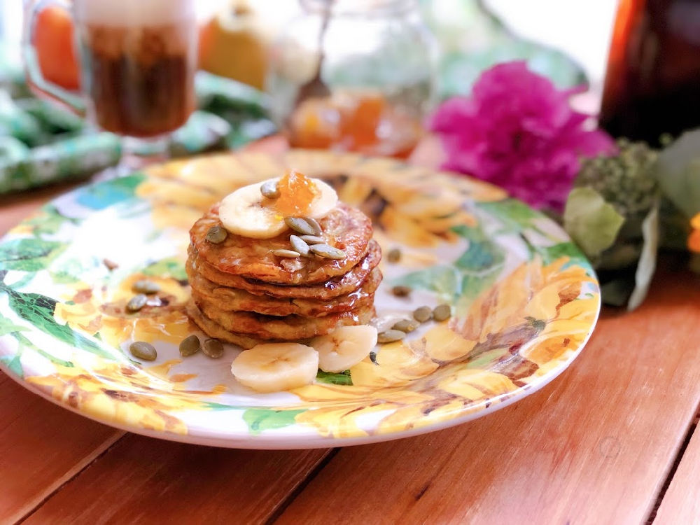 Flourless pancakes using banana, egg, and oats. Served with honey, pepitas, and honeycomb.