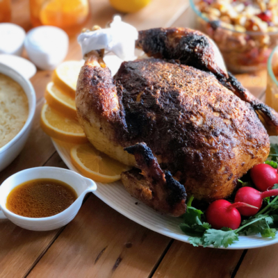 Homemade rotisserie chicken dinner served with all the fixings