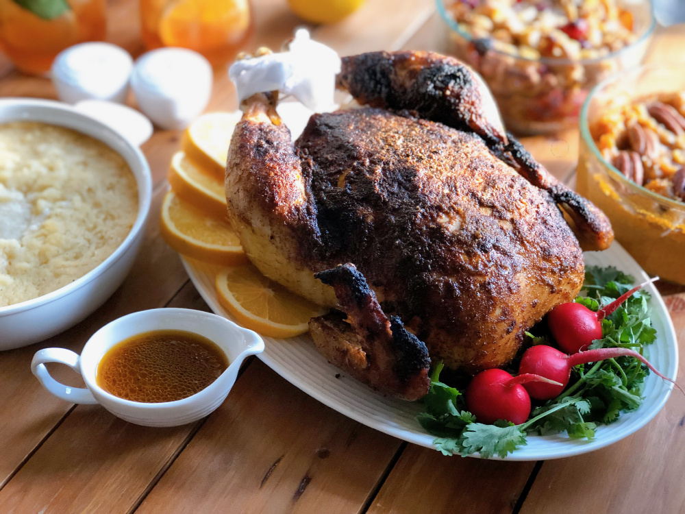 Homemade rotisserie chicken dinner served with all the fixings