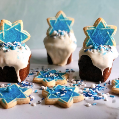Hanukkah cupcakes with Star of David cookie topper and sprinkles