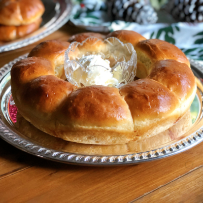 Rutabagas dinner rolls served on a tray with whipped butter