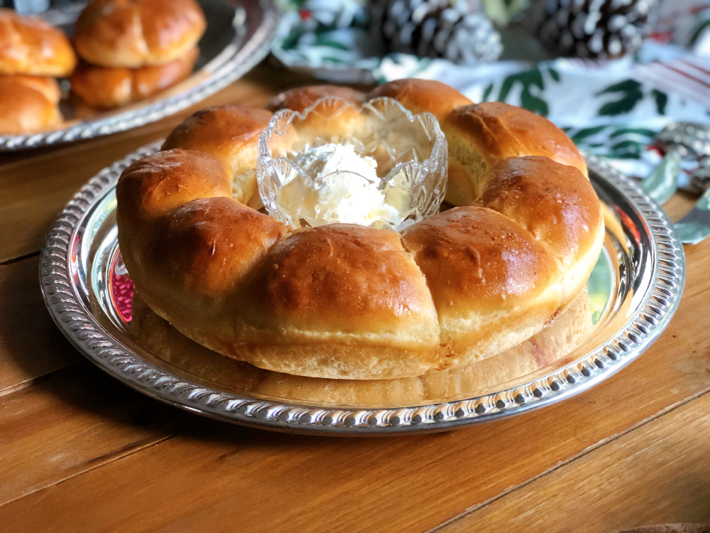 Rutabagas dinner rolls served on a tray with whipped butter