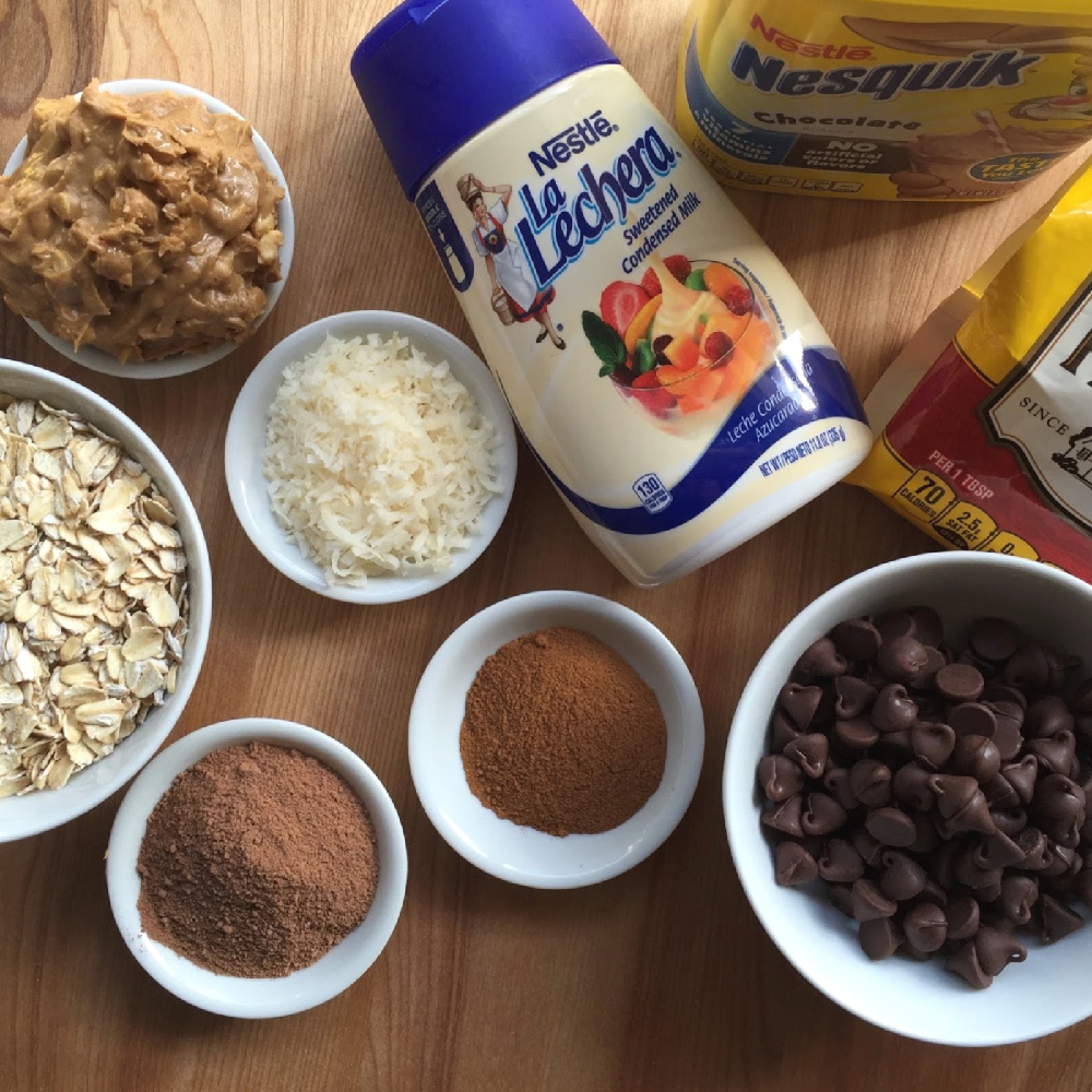 The ingredientes for the chocolate bonbons includes condensed milk, oats, chocolate, sugarless coconut flakes, cinnamon, peanut butter, and semi-sweet chocolate morsels