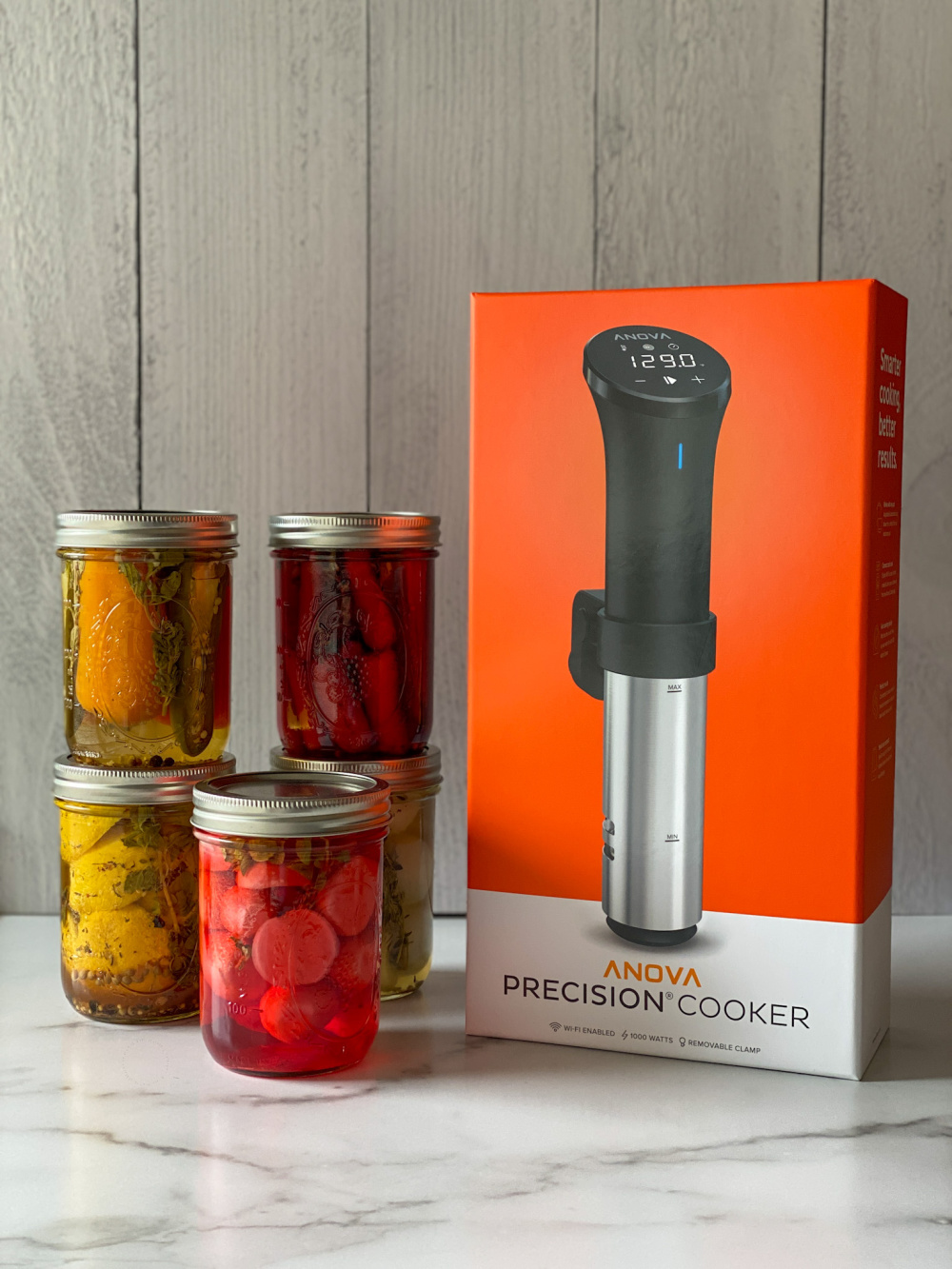 Showing the Anova precision cooker and five jars of pickles 